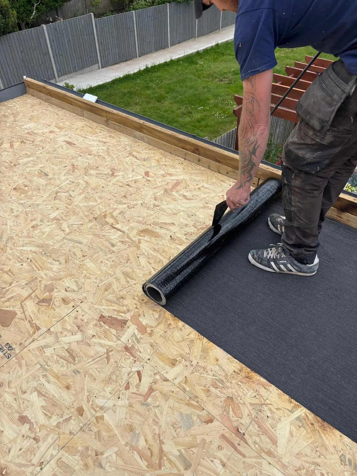 New felt roofing installation in progress