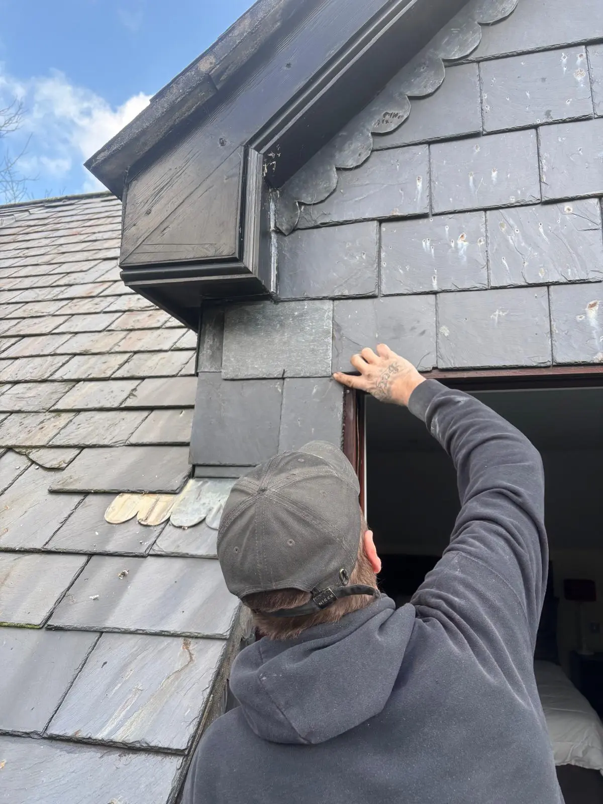 Careful slate work around a dormer